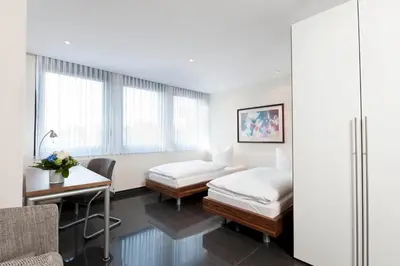 Ein Bett oder Betten in einem Zimmer der Unterkunft Appartements am Kleeblatt