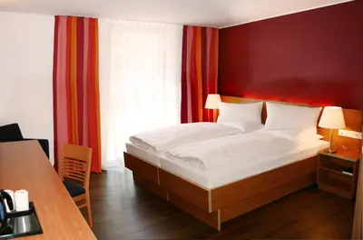 Ein Bett oder Betten in einem Zimmer der Unterkunft Hotel Franz