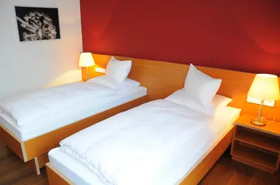 Ein Bett oder Betten in einem Zimmer der Unterkunft Hotel Franz