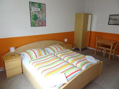 Ein Bett oder Betten in einem Zimmer der Unterkunft Gästehaus Grupello