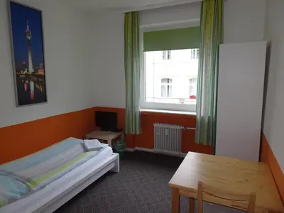Ein Bett oder Betten in einem Zimmer der Unterkunft Gästehaus Grupello