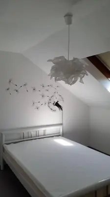 Ein Bett oder Betten in einem Zimmer der Unterkunft Dachgeschoss35