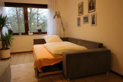 Ein Bett oder Betten in einem Zimmer der Unterkunft Ferienwohnung am Baldeneysee