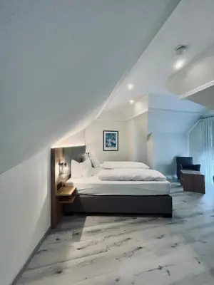 Ein Bett oder Betten in einem Zimmer der Unterkunft Hotel-Restaurant Zum Schwanen