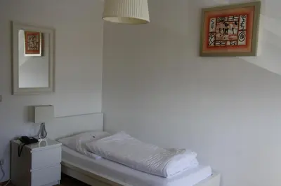 Ein Bett oder Betten in einem Zimmer der Unterkunft Hotel Schwarzer Adler