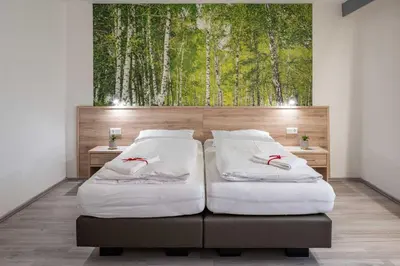 Ein Bett oder Betten in einem Zimmer der Unterkunft Hotel Wildpferd Dülmen