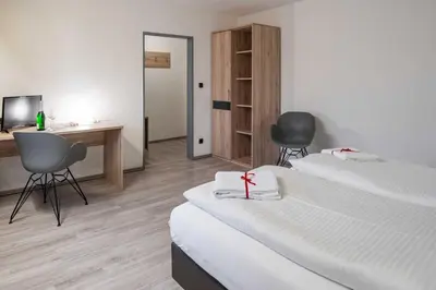 Ein Bett oder Betten in einem Zimmer der Unterkunft Hotel Wildpferd Dülmen