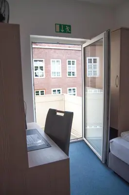 Ein Bett oder Betten in einem Zimmer der Unterkunft also-Hotel an der Hardt