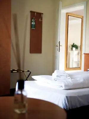 Ein Bett oder Betten in einem Zimmer der Unterkunft Boutique Hotel Villa Stockum