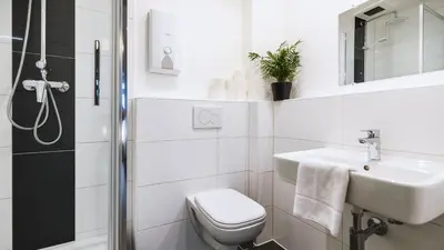 Ein Badezimmer in der Unterkunft Hotel Schwaferts