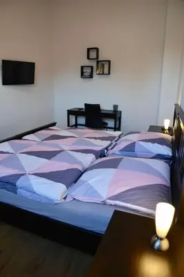 Ein Bett oder Betten in einem Zimmer der Unterkunft Gästehaus LeLo 3
