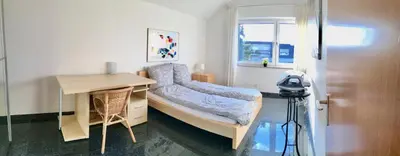 Ein Bett oder Betten in einem Zimmer der Unterkunft Bredeneyer Straße 66A