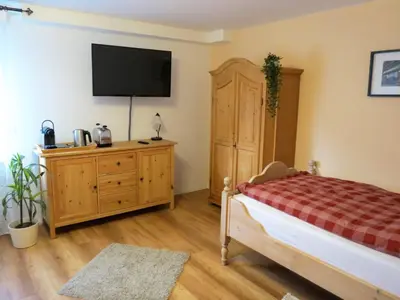 Ein Bett oder Betten in einem Zimmer der Unterkunft Gästehaus Schönenberg