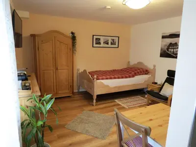 Ein Bett oder Betten in einem Zimmer der Unterkunft Gästehaus Schönenberg