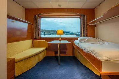 Ein Bett oder Betten in einem Zimmer der Unterkunft Hotelschiff Messe Düsseldorf