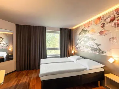 Ein Bett oder Betten in einem Zimmer der Unterkunft B&B Hotel Düsseldorf-Hbf
