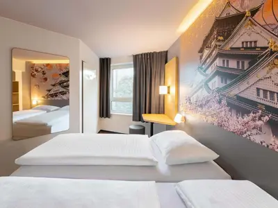 Ein Bett oder Betten in einem Zimmer der Unterkunft B&B Hotel Düsseldorf-Hbf
