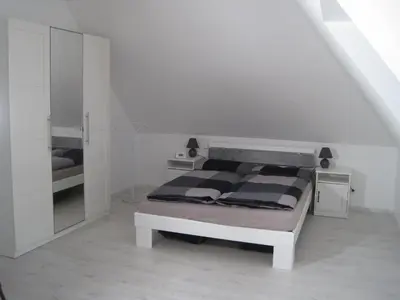Ein Bett oder Betten in einem Zimmer der Unterkunft Töfte Bude