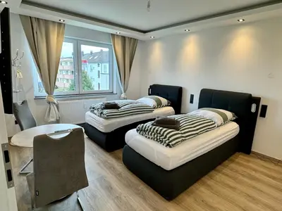 Ein Bett oder Betten in einem Zimmer der Unterkunft Aparts House Essen - Balkon - Free Parking- WiFi - Kitchen