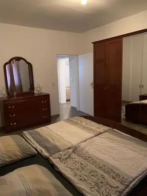 Ein Bett oder Betten in einem Zimmer der Unterkunft Feuerbachstr.9 Ferienwohnung