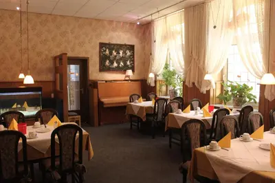 Ein Restaurant oder anderes Speiselokal in der Unterkunft Hotel Westfälischer Hof