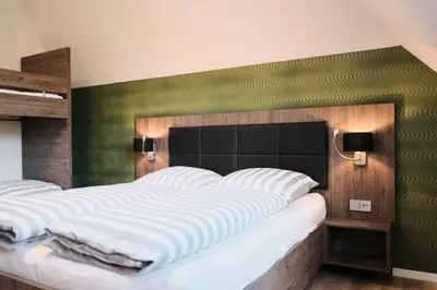 Ein Bett oder Betten in einem Zimmer der Unterkunft Beisenbusch Hotel & Restaurant
