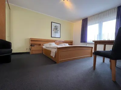 Ein Bett oder Betten in einem Zimmer der Unterkunft Hotel Kaufhold - Haus der Handweberei
