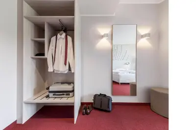 Ein Bett oder Betten in einem Zimmer der Unterkunft Serways Hotel Remscheid
