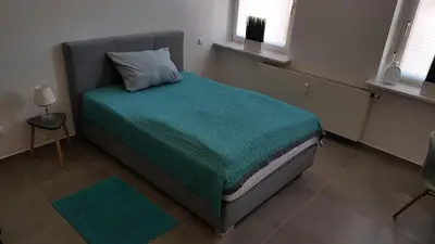 Ein Bett oder Betten in einem Zimmer der Unterkunft Zimmervermietung Mülheim