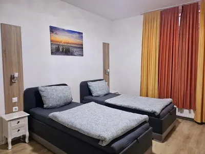 Ein Bett oder Betten in einem Zimmer der Unterkunft Pension an der Zeche