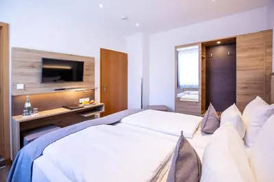 Ein Bett oder Betten in einem Zimmer der Unterkunft Landgasthof-Hotel Zum Steverstrand