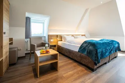 Ein Bett oder Betten in einem Zimmer der Unterkunft Landgasthof-Hotel Zum Steverstrand