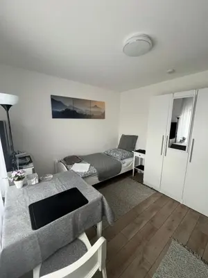 Ein Sitzbereich in der Unterkunft Rooms in Düsseldorf near the Airport/Fair