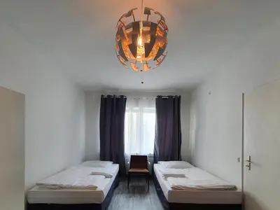 Ein Bett oder Betten in einem Zimmer der Unterkunft Aparthouse Graf-Adolf