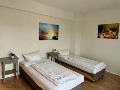 Ein Bett oder Betten in einem Zimmer der Unterkunft Aparthouse Graf-Adolf