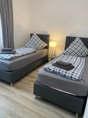Ein Bett oder Betten in einem Zimmer der Unterkunft Holiday Apartments Essen - Free Parking - WiFi - Kitchen