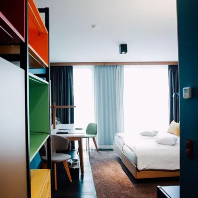 Ein Bett oder Betten in einem Zimmer der Unterkunft Claudius Hotel