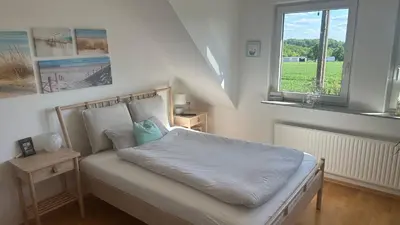 Ein Bett oder Betten in einem Zimmer der Unterkunft Kleine Auszeit mit Aussicht Velbert Tönisheide