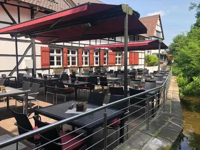 Ein Restaurant oder anderes Speiselokal in der Unterkunft Hotel & Gastropark Loemühle