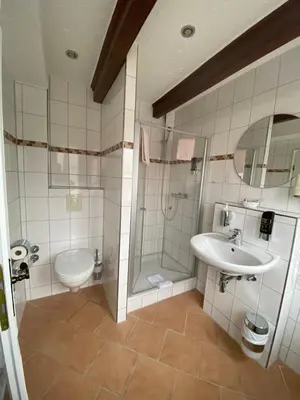 Ein Badezimmer in der Unterkunft Hotel & Gastropark Loemühle