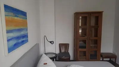 Ein Bett oder Betten in einem Zimmer der Unterkunft Schillers Hotel & Café - GARNI -