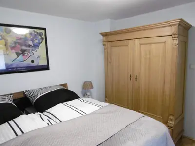 Ein Bett oder Betten in einem Zimmer der Unterkunft Gästehaus Chateau d‘Orsay
