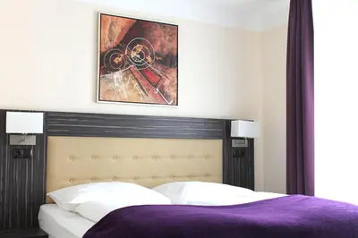 Ein Bett oder Betten in einem Zimmer der Unterkunft Hotel Famosa