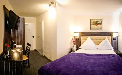 Ein Bett oder Betten in einem Zimmer der Unterkunft Hotel Famosa