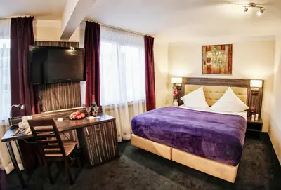 Ein Bett oder Betten in einem Zimmer der Unterkunft Hotel Famosa