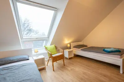 Ein Bett oder Betten in einem Zimmer der Unterkunft Wohnen wie zu Hause