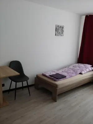 Ein Bett oder Betten in einem Zimmer der Unterkunft Duisburg Beeck