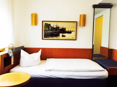 Ein Bett oder Betten in einem Zimmer der Unterkunft Hotel Imperial