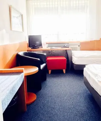 Ein Bett oder Betten in einem Zimmer der Unterkunft Hotel Imperial