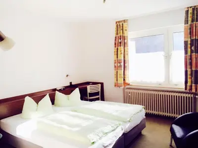 Ein Bett oder Betten in einem Zimmer der Unterkunft Hotel Imperial